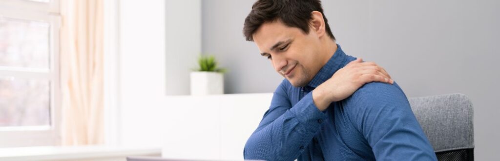 man with raised shoulders